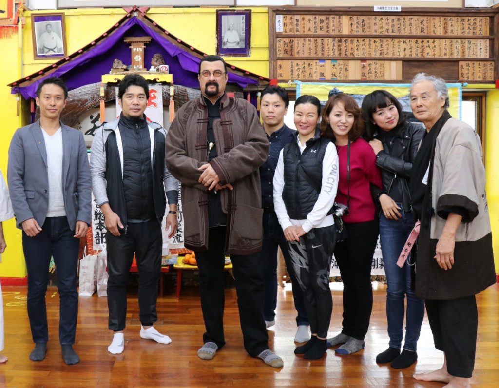 Steven Seagal with the Ageshio Japan team in a dojo