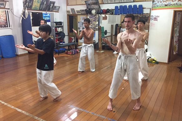 Students training with Haruyoshi Shimabukuro Sensei in his dojo