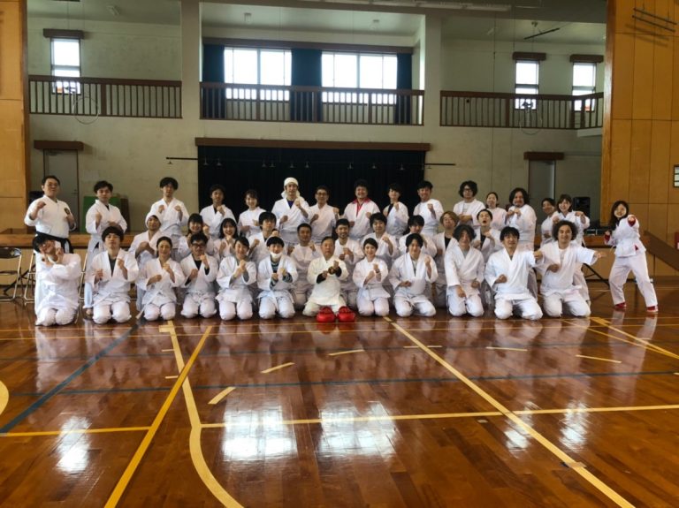 Company group in karate gi after a karate trial session