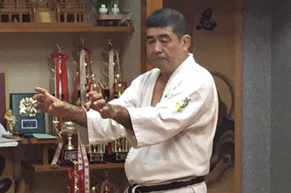 Haruyoshi Shimabukuro Sensei demonstrating a stance in his dojo