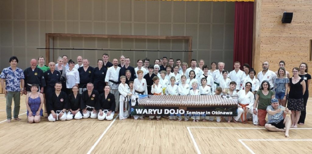 Waryu Dojo group with their banner at a budo camp in Okinawa