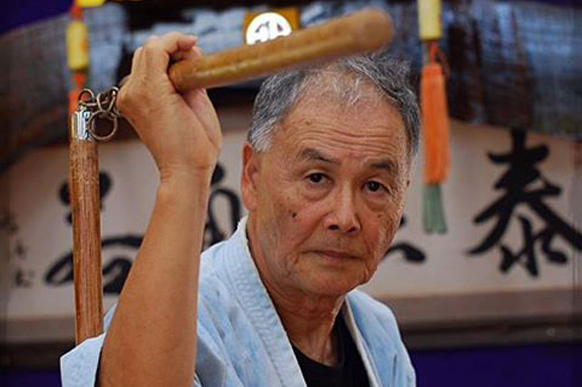 Tetsuhiro Hokama Sensei with a traditional weapon