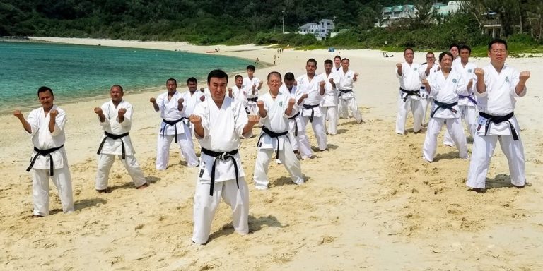 Karate group training on a beach in Okinawa