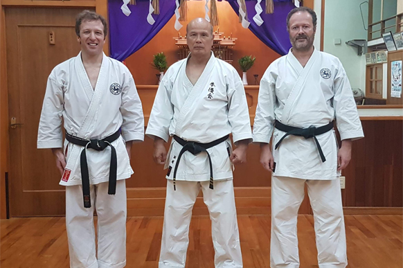 Kiyohide Shinjo Sensei with two students in the Kenyukai honbu dojo