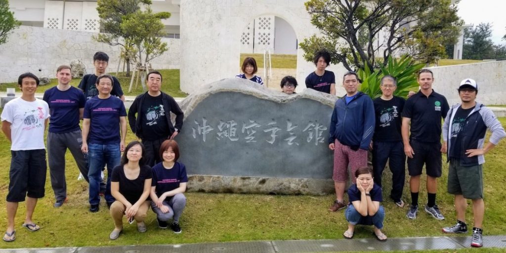 Shito-Ryu Shobukan workshop group at the Okinawa Karate Kaikan stone