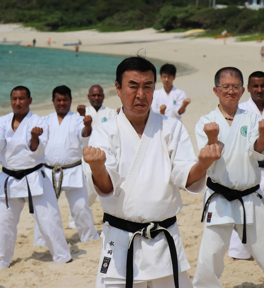 Karate group training on a beach in Okinawa